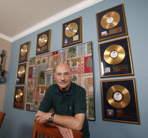 To Our Children's Children's Children's Walls: Pinder at home, surrounded by many of his gold achievements.