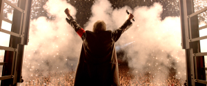 ROGER_WATERS_1 - ARMS UP BEHIND SHOT WITH COAT AND CROWD